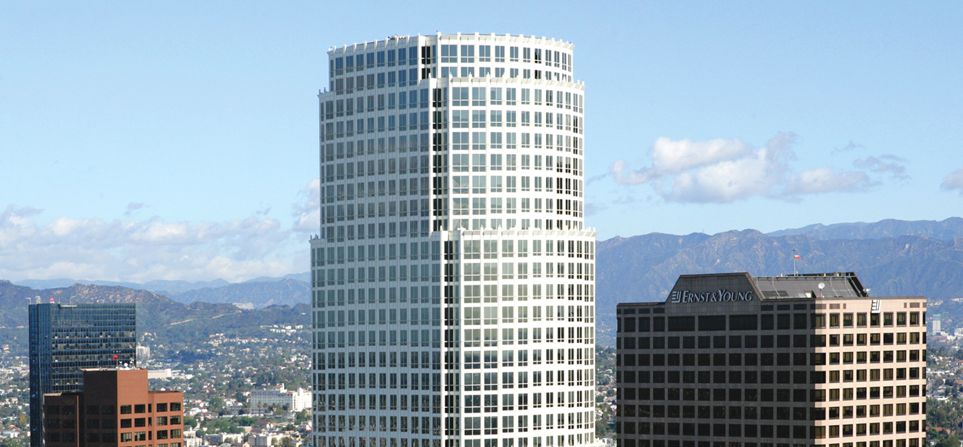 Decorative image of the top of 777 Tower with the city and mountains in the background