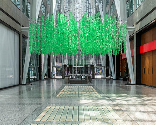 Long shot of Galleria with plastic water bottles hanging from ceiling.