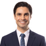 Andrew West is the Property Manager at Bay Adelaide Centre. Andrew is a white male with dark brown hair, wearing a suite jacket, white dress shirt and blue tie.