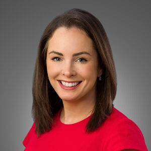 photo of Clare Farry, brown hair, red blouse