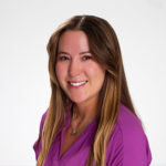 Portrait of Rachel Ballard in a fuchsia blouse.